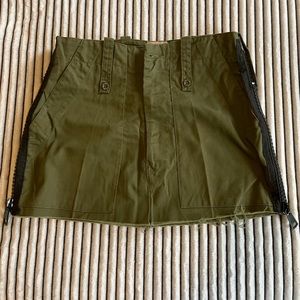 Army green mini skirt w/ thick black slippers on sides (no size tag fits like M)
